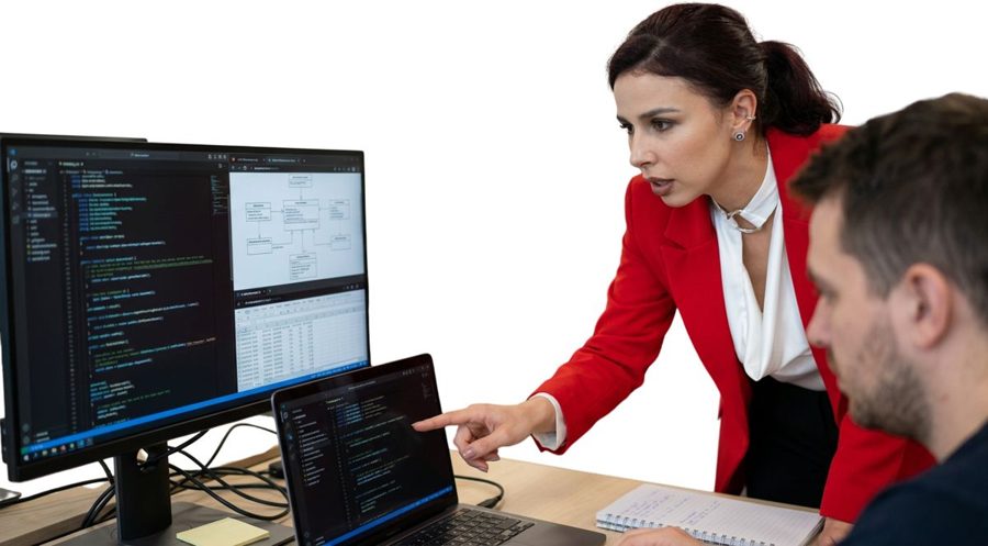 Silvija Gelevski reviewing data with a team at a workstation.